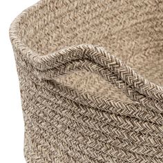 a close up view of a basket made out of jute and woven with a white background