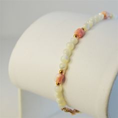 Coral Tulip Bracelet Elegant Coral & Mother Of Pearl Beads, 7”, And Gemstones Set In Yellow Gold Filled. White Single Strand Beaded Bracelet For Gift, White Single Strand Bracelet Gift, White Single Strand Bracelet As A Gift, Elegant White Bracelet With Colorful Beads, Elegant White Pearl Bracelet With Colorful Beads, Adjustable Single Strand White Bracelet, Elegant White Pearl Bracelet With Faceted Beads, Adjustable White Bracelet With Polished Beads, White Polished Beads Bracelets As Gift