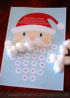 a calendar with cotton balls and santa clause on it