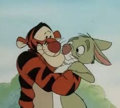 winnie the pooh and tigger hugging each other