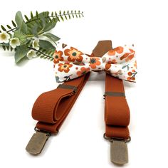 Burnt Orange Suspenders Set, Burnt Orange Floral bow tie, Wedding bow tie, Groom bow tie, Ring bearer, Bow Tie for men, baby, boy, kids  Dimensions; (approx) » BABY newborn / 18 months     length 3.3"inches / 8 cm width 1.58" inches / 4cm » LITTLE BOY / 18 months - 5 yrs     length 3.7" inches / 9.5cm width 1.58" inches / 4cm  » BOY / 5 - 10 yrs     lenghh 4" inches / 10.50cm width 1.96" inches / 5cm » TEEN     lenghh 4.33" inches / 11cm width 2.36" inches / 6cm » ADULT    lenghh 4.72" inches / Adjustable Bow Tie For Groom, Summer, Adjustable Summer Bow Tie For Groom, Adjustable Summer Bow Tie For Grooms, Adjustable White Bow Tie With Decorative Bow, Summer Wedding Bow Tie For Groom, Adjustable White Bow Tie Back, White Adjustable Bow Tie Back, Dapper Adjustable Bow Tie With Detachable Bow, Dapper White Adjustable Bow Tie