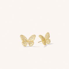 Transform your style with our Butterfly Stud Earrings. These earrings feature a delicate butterfly pendant, adding a touch of whimsy and playfulness to any outfit. Perfect for nature lovers or anyone looking to add a unique statement piece to their jewelry collection. MATERIALS 14K Gold Plating Stainless Steel Lobster claw clasp 100% Handmade with care 100% Nickel Free SIZE 1cm Gold Butterfly Earrings Fine Jewelry, Gold Butterfly Earrings Studs, Dainty Yellow Gold Butterfly Earrings, Gold Butterfly Charm Earrings, Elegant Gold Butterfly-shaped Earrings, Butterfly Stud Earrings, Delicate Butterfly, Butterfly Earrings Stud, Layered Bracelets