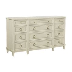 a white dresser with many drawers on it