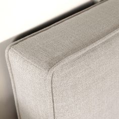 a close up view of the back end of a couch with no cushions on it