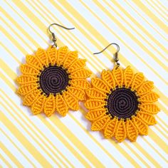 Stand out from the crowd with these beautiful sunflower earrings. -Ready to ship.  -They are made with waxed polyester thread.  -These earrings are approximately 2 and 1/4 inches of diameter. -Colors may vary slightly due to lighting and/or monitor settings. -Shipping available to US and Puerto Rico. Bohemian Yellow Sunflower Earrings, Summer Sunflower Dangle Earrings, Yellow Sunflower Design Earrings For Summer, Summer Flower Earrings With Sunflower Design, Summer Sunflower Design Earrings, Summer Sunflower Design Flower Earrings, Handmade Summer Flower Earrings, Bohemian Summer Jewelry With Sunflower Design, Bohemian Sunflower Design Jewelry For Summer