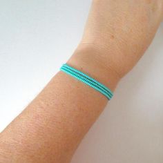 This is a set of 3 turquoise bracelets.  We can make these in any color! Also, please choose size at checkout.❤ SIZESThis item comes in several sizes, kindly choose at checkout. The standard size for an average woman is 7”. For a child, perhaps a 6” would be appropriate.❤ PROCESSING AND SHIPPINGMost orders are made and shipped out in one business day. Please check delivery timeframes for your location on the description below. ❤ CUSTOM ORDERSIf you like this item in a different color, send me a Turquoise Bracelets With Tiny Beads For Gifts, Turquoise Bracelets With Tiny Beads As Gift, Turquoise Friendship Bracelets With Tiny Beads As Gift, Turquoise Friendship Bracelet With Tiny Beads As Gift, Turquoise Minimalist Beaded Bracelets As Gift, Minimalist Turquoise Beaded Friendship Bracelets, Turquoise Stackable Friendship Bracelets As Gift, Simple Beaded Bracelets, Average Woman