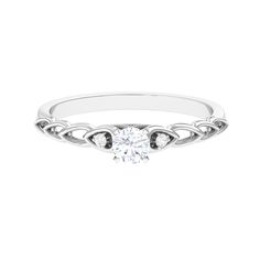 a white gold engagement ring with an intricate design