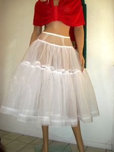 1950s Design Petticoat  Crinoline Can-can Crinoline Petticoat With Tiered Skirt, Can-can Crinoline Tiered Petticoat, Tulle Petticoat With Attached Cancan, Vintage Voluminous Full Skirt Petticoat, Vintage Full Voluminous Petticoat, Fitted Crinoline Petticoat For Party, Fitted Full Skirt Tulle Petticoat, White Fitted Petticoat For Costume Party, Fitted White Petticoat For Costume Party