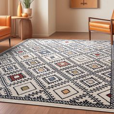 a living room area with a rug, chairs and vases on the floor in front of a window