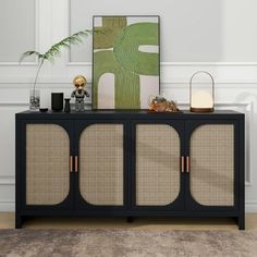 a black cabinet with rattan doors and gold handles in a white living room area