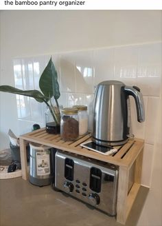 a toaster and coffee maker on a wooden shelf