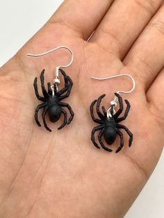 Black Spider Earrings 🕷️🧠⚡️ ---------------------------------------- P R O D U C T  D E T A I L S: * Unique, funky & realistic Spider earrings! * Lightweight, dangle earrings  * Hypoallergenic earrings hooks * Handmade with love + care by us, a woman owned small business from Florida 🌞 ----------------------------------------- S H I P P I N G: 📬FREE SHIPPING on orders over $35+ worldwide - shipping times vary 📬All orders receive a FREE gift! Black Single Earring For Halloween, Black Novelty Drop Earrings, Handmade Black Novelty Earrings, Black Novelty Earrings For Gifts, Novelty Black Earrings For Gift, Black Novelty Earrings For Gift, Earrings Grunge, Grunge Earrings, Earrings Y2k