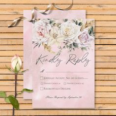 a pink wedding card with roses on it