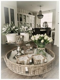 a wicker tray with flowers on it in a living room