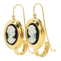 Cameo earrings are relatively hard to find — beautiful cameo earrings are even harder to find! Made of 18K yellow gold, these lovely vintage Muraro earrings each have a bezel set black and white shell cameo at their center, with a carving of a woman in profile with her hair up and tied with a ribbon. Metal: 18K Yellow Gold Elegant Cameo Earrings, Elegant Cameo Jewelry For Formal Occasions, Classic Intaglio Earrings As A Gift, Elegant Cameo Earrings As Gift, Classic Intaglio Earrings For Formal Events, Elegant Cameo Earrings For Gift, Classic Intaglio Earrings For Formal Occasions, Classic Cameo Earrings, Classic Cameo Earrings Gift