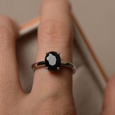 Solitaire ring natural black spinel ring oval cut gemstone | Etsy Black Oval Sapphire Promise Ring, Classic Black Oval Sapphire Ring, Classic Black Sapphire Oval Ring, Classic Black Spinel Ring, Classic Oval Black Spinel Jewelry, Elegant Oval Black Spinel Rings, Black Oval Promise Ring, Oval Black Rings For Promise, Oval Black Promise Ring