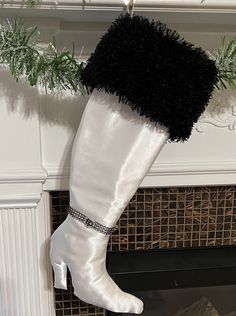 Full of uniqueness and glamour, our custom made holiday High Heel Boot Christmas stockings will certainly make a statement. These are custom made by Zoe and Eve and features a stocking made in the shape of a high heel boot, with faux fur surrounding the top and a decorative blinged-out boot belt around the ankle. Each boot is approximately 10" tall and is perfect for holding bottles of wine or several small gifts. 👉Turnaround Time is 3-5 business days from order, plus delivery time.👉Business d White Boots For Chrismas Party, Thigh-high Heels For Winter Parties, Winter Knee-high Heels In Faux Leather, Winter White Pointed Toe Knee-high Boots, White High Heel Knee-high Boots For Winter, Off The Shoulder Tee, Flowy Shirt, Heel Boot, Fur Trim