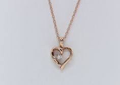 Cherish the elegance of our 14K Rose Gold Heart Pendant, gracefully adorned with .03 carats total weight of Lab Diamonds, accompanied by an 18" Chain. This exquisite piece is skillfully handcrafted by our artisanal goldsmith at Jewelry By You. Gold Heart Pendant, Heart Pendant Gold, Rose Gold Heart, Gold Heart, Lab Diamonds, Heart Pendant, Diamond Jewelry, Jewelry Necklace Pendant, Jordan