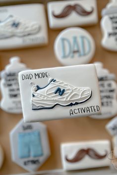 a close up of a person's hand holding a badge with a shoe on it