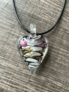 This necklace is made with a Murano glass heart and that has white and black Colors. Note: Colors may vary depending on your monitor  I do have other colors for the necklace strands for both multi and single strand.  If you are looking for a different variation, feel free to touch base with me and I can let you know if I have what you are looking for. Shipping Info: All orders are shipped from Canada and they are sent through Canada Post.  If you would like expedited/faster shipping, it will cos Heart-shaped Glass Necklaces For Jewelry Making, White Heart Shaped Necklaces For Jewelry Making, White Heart Necklaces For Jewelry Making, Clear Heart Charm Necklace, Clear Glass Heart-shaped Jewelry, White Heart Pendant Necklace For Jewelry Making, Clear Glass Heart Pendant Necklace, Glass Heart Pendant Necklace With Heart Charm, White Heart Beaded Pendant Necklace