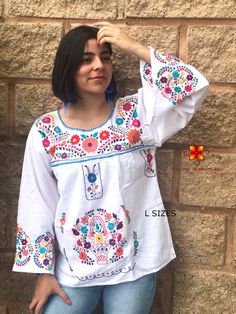 Well designed and well embroidery only for you. Mexican blouse embroidered flowers bell sleeve. This is a blouse embroidered by hand with beautiful colorful flowers. Very comfortable, Goes great with jeans, leggings, skirt, shorts... Each piece is unique and handmade with dedication and taking care of every detail achieving the best quality in our products, which is why it makes it beautiful and unique each of the embroidered flowers. More style, check the following link: https://www.etsy.com/mx Spring Embroidered Long Sleeve Top With Motif, Long Sleeve Embroidered Top With Motif For Spring, Summer Embroidered Blouse With Bell Sleeves, White Long Sleeve Tops With Intricate Embroidery, White Embroidered Long Sleeve Blouse, White Embroidered Top With Motif For Spring, Summer Bell Sleeve Blouse With Floral Embroidery, Summer Floral Embroidered Bell Sleeve Blouse, Floral Embroidered Bell Sleeve Blouse For Summer