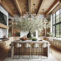 an elegant kitchen with marble counter tops and wooden ceilinging, surrounded by large windows