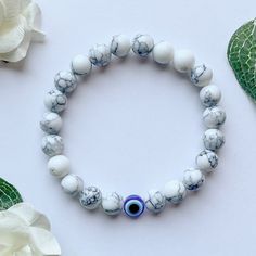 Symbolic White Beaded Bracelets As Gifts, Symbolic White Bracelets With Round Beads, Symbolic White Round Bead Bracelets, Handmade White Symbolic Beaded Bracelets, Handmade Symbolic White Beaded Bracelet, Casual White Evil Eye Bracelet Gift, Casual White Handmade Evil Eye Bracelet, White Evil Eye Beaded Bracelets, White Evil Eye Bracelets As Gift