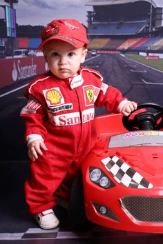 a baby in a race car costume