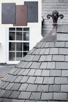 a black and white photo of a roof with three square tiles on it's side