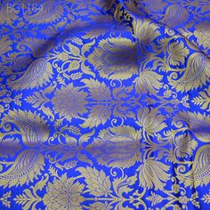 Royal Blue Brocade Banarasi Fabric by the Yard Banarasi Brocade for Wedding Dress lehenga Skirt Costume Crafting Home Decor Table Runner. This is a beautiful heavy benarse art silk brocade floral design fabric in Royal Blue and Gold.  ➤Product: Brocade Fabric ➤Fabric Type: Blended Silk (Viscose and Silk) Fine quality Zari Brocade Weaving from Banarasi ➤Color: Royal Blue and Gold ➤Width: 44 inches. ➤Condition: New ➤Code: bg1184 ➤Listing for 1 Yard of fabric. ➤Care: Dry Clean Only You can use this fabric to make Dresses, Tops, Blouses, Jackets, Crafting, Clutches or Evening Bags, Embellish your clothes, Pillows, Drapery, Home Décor, Outdoor, Quilting, Sewing, General, Upholstery etc use it for scrap booking projects. If you purchase more than 1 Yard you will get it in running length, not in Blue Katan Silk Lehenga With Traditional Drape, Blue Katan Silk Lehenga For Wedding, Royal Traditional Wear For Diwali In Traditional Drape, Royal Traditional Wear For Festive Ceremonies, Royal Traditional Wear For Diwali, Festive Blue Katan Silk Lehenga, Blue Katan Silk Lehenga With Zari Work, Royal Blue Festive Traditional Wear, Royal Traditional Wear With Pallu For Festive Season