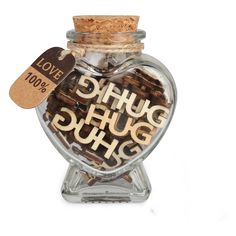 a glass jar filled with lots of different types of chocolates next to a tag