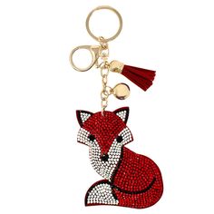 a key chain with a red fox on it