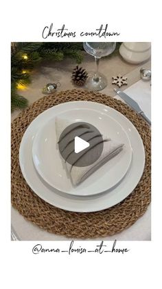 a white plate topped with a slice of cake on top of a table next to a christmas tree