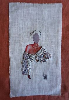 a piece of cloth with an image of a woman on it