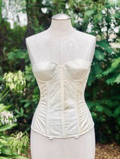 Pretty Vintage White Scalloped Corset from the 1950's. There is a lace pattern on the scalloped design of the bustier corset. Such a pretty top for an intimate addition to your outfit. Fitted Delicate Lace Corset, Lace Underwire Corset With Lace Trim, Elegant Underwire Corset With Lace Trim, Coquette Lace Corset With Underwire, Lace Coquette Underwire Corset, Lace Underwire Coquette Corset, Coquette Lace Underwire Corset, Fitted Lace Trim Corset In Coquette Style, Feminine Fitted Corset With Corset Back