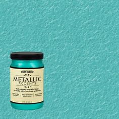 a jar of metallic acrylic paint on a blue background