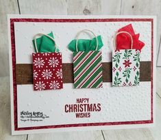 three christmas bags on top of each other with the words happy christmas wishes written in red, green and white