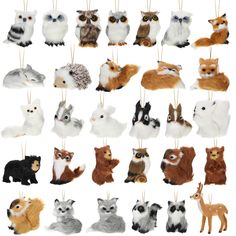 an assortment of stuffed animals hanging from strings on a white background with clippings