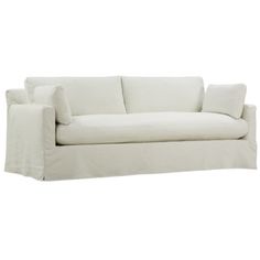 a white couch with two pillows on it