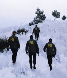 four men walking up a snowy hill with trees in the background and snow on the ground