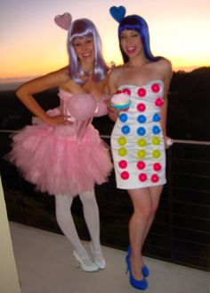 two women dressed in costumes standing next to each other