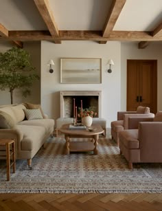 a living room with couches, chairs and a fire place in the fireplace area