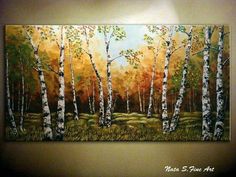 a painting on the wall of a room with trees and grass in front of it