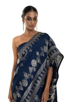 Elevate your style with our Blue Floral Printed Art Silk handwoven saree featuring allover stone embroidery work. This saree exudes elegance, ideal for family gatherings or formal events. Experience timeless beauty that will be a wardrobe treasure for years to come. Elegant Pre-draped Saree With Motifs For Navratri, Festive Pre-draped Saree With Motifs For Reception, Elegant Pre-draped Saree With Motifs For Festivals, Eid Reception Zari Weaving Pre-draped Saree, Elegant Jamawar Pre-draped Saree For Eid, Eid Reception Blouse Piece With Zari Weaving, Eid Blouse Piece With Zari Weaving For Reception, Banarasi Silk Pre-draped Saree For Eid Reception, Eid Blouse Piece For Reception With Zari Weaving