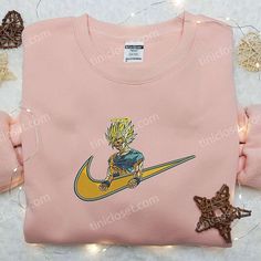 Introducing the Goku Angel x Nike Embroidered Shirt, a must-have for all Dragon Ball enthusiasts! This custom shirt combines the iconic Nike logo with intricate Goku Angel embroidery, creating a unique fusion of style and fandom. Crafted with precision, this shirt boasts high-quality materials that ensure comfort and durability. With its eye-catching design, this shirt [...] Rapunzel Cartoon, Nike Cartoon, Nike Inspired, Best Family Gifts, Maroon Hoodie, Obito Uchiha, Embroidered Shirts, Tyler Durden, Anime Sweatshirt