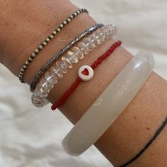 white, red seed bead bracelets with red heart bead Everyday White Beaded Bracelets With Heart Beads, Everyday White Heart Bracelet With Letter Beads, Everyday White Heart-shaped Beaded Bracelets, White Heart Shaped Stretch Bracelet With Letter Beads, White Heart-shaped Stretch Bracelet With Letter Beads, White Heart Bracelet With Colorful Beads, White Heart Shaped Bracelet With Colorful Beads, White Heart Beads Stretch Bracelet, White Heart Shaped Stretch Bracelet With Heart Beads