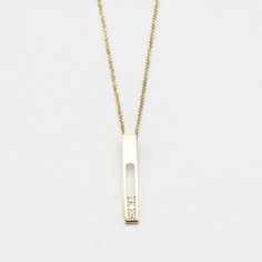 18k gold necklace with vertical gold bar and decorated with 3 diamonds in an elegant line prong setting. Handcraft spring ring clasp closer Necklace measure: 16 inches Pendant measure: 2.5 mm W x 30 mm H Modern 14k Yellow Gold Bar Necklace, Elegant Rectangular Bar Necklace As Gift, Elegant Rectangular Bar Necklace For Gift, Elegant Rectangular Bar Necklace Gift, Classic Bar Necklace With Diamond Accents For Gifts, Rectangular Single Cut Diamond Jewelry Gift, Minimalist Diamond Rectangular Pendant Jewelry, Modern Yellow Gold Nameplate Jewelry, Modern 14k Gold Nameplate Jewelry