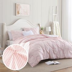 a bed with pink comforter and pillows in a bedroom