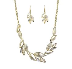 "Beautiful and timeless silver and gold color leaf necklace and earring set.  It is designed with silver enamel applied to the leaves and with a gold plating around each leaf.  It is mixed with marquise shape crystals set on some leaves.  It is light weight and comfortable to wear around the neckline.  A nice two tone silver and gold necklace set for everyday or and speial occasion.   The necklace length is approximately 17.5\" with a 3\" extender chain The finish is in gold tone plating The earrings are pierced Earrings are 1 5/8\" long Fast shipping. All items are securely packaged with extra bubble packing to avoid any damage in shipping.     Please contact us if you are not satified with any purchase so you can return it for a refund." Gold Leaf Shaped Metal Jewelry, Leaf-shaped Metal Jewelry With Matching Earrings, Metal Leaf-shaped Jewelry, Silver And Gold Necklace, Gold Necklace Set, Necklace And Earring Set, Leaf Necklace, Silver Enamel, Jewellery Sets