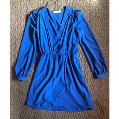 Nwot Size Small Tried On Once, Never Worn. Lulu E. Bebe Long Sleeve Blue Dress. The Perfect Balance Of Flowy And Drapey, In A Shade Of Blue That Complements Every Skin Tone. The Perfect Outfit For Date Night, A Summer Bbq, Vacation, A Night Out Dancing, A Trip To The Beach, Etc. You Know How Hard It Is To Find That Dress That’s Perfect For A Guest To A Wedding But Versatile Enough To Wear Through All 4 Seasons? This Is That Dress. Blue V-neck Mini Dress For Fall, Royal Blue V-neck Spring Dress, Chic Royal Blue V-neck Mini Dress, Blue Surplice Neckline Dress For Date Night, Chic Blue Mini Dress With Surplice Neckline, Blue Dress With Surplice Neckline For Night Out, Blue V-neck Mini Dress For Work, Royal Blue Long Sleeve Mini Dress For Spring, Blue Spring Dress With Surplice Neckline